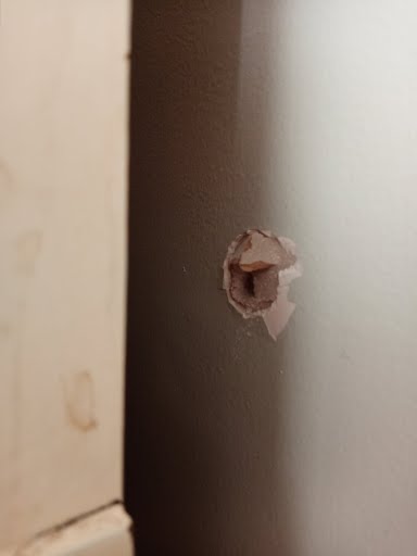 Bullet hole in an interior wall
